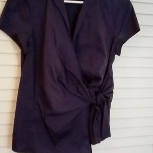 New York Company wrap blouse with bow closure.